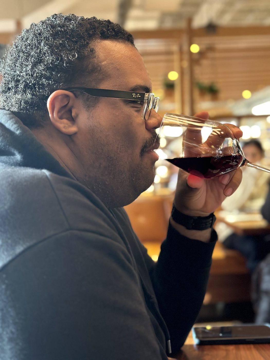 A guest sipping wine at a tasting